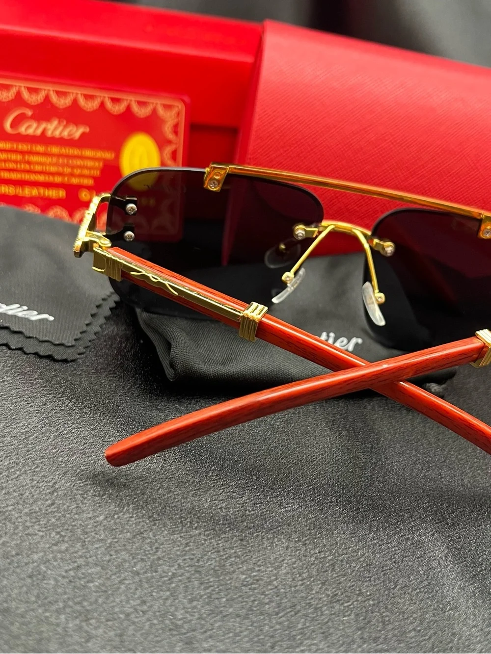 Cartier Men’s Black and Gold Rimless Sunglasses